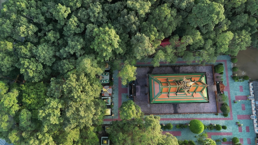 Aerial footage above the Wat Koskeoserey, a Khmer pagoda in Tra Vinh province, south Vietnam. Drone film from top to down slide from the left to the right.