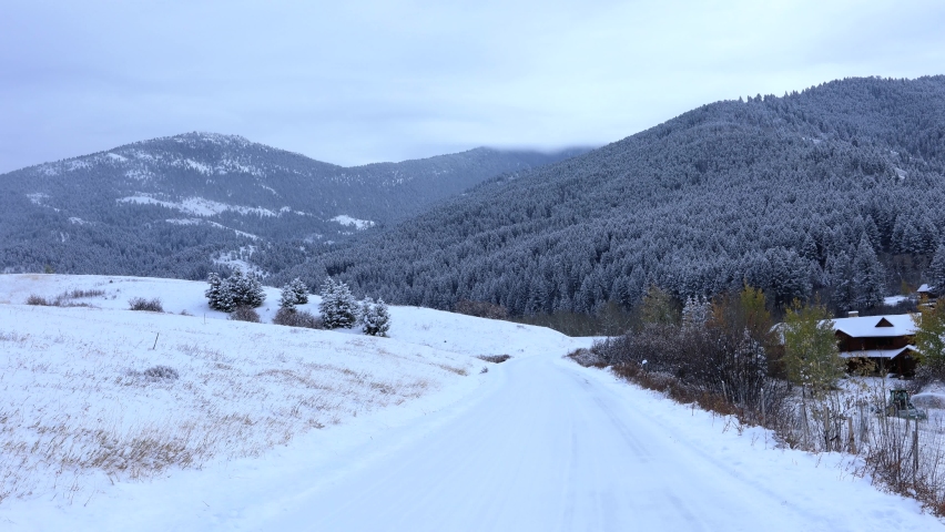 Montana Snowy Road Leading to Forest in Bozeman 4K