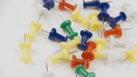 Pushpins are spinning on a turntable. View from above. Close-up - Powered by Shutterstock - Get 15% off with code: PIKWIZARD15