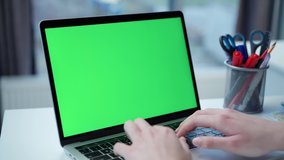 Laptop with Green Mock-up Screen Close-up. Business Lady or IT Specialist Works Sitting at Table with Notebook - Powered by Shutterstock - Get 15% off with code: PIKWIZARD15