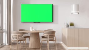 LED TV with blank green screen, hanging on the wall at home. TV video mock up with Chroma Key. Copy space for advertising, movie, app presentation. Empty television screen. Modern interior. 3D render.