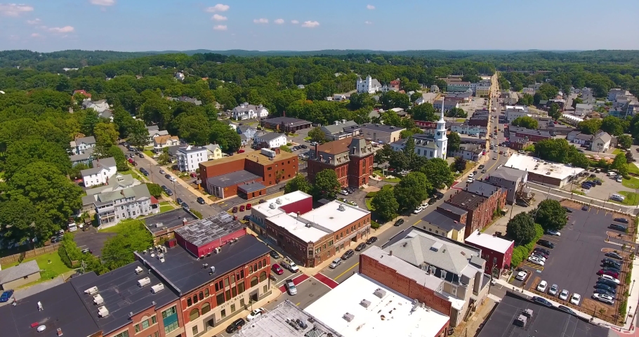 Hudson historic commercial district aerial view on Main Street including Town Hall and Unitarian Church in town center of Hudson, Massachusetts MA, USA. 