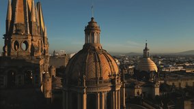 Beautiful sunset above the square with gothic spires towering the city. Drone footage of Plaza Guadalajara with cinematic views on the Cathedral. High quality 4k footage - Powered by Shutterstock - Get 15% off with code: PIKWIZARD15