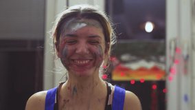 Portrait of a female artist. Girl with clumsy clorful painted face. Smiling. - Powered by Shutterstock - Get 15% off with code: PIKWIZARD15