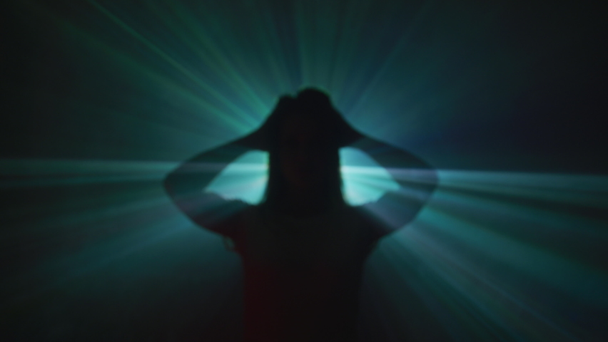 Light projected behind a screaming girl