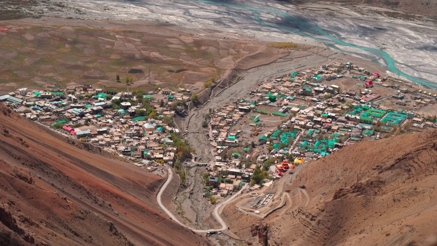 4K High angle Handheld shot of Kaza town in Spiti Valley as seen from top of a mountain at Lahaul and Spiti District in Himachal Pradesh, India. View of the town from above the mountains.  | Shutterstock HD Video #1096768907