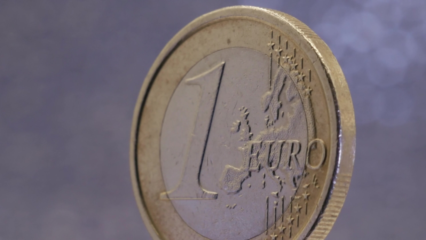 Macro close-up shot one euro coin spinning, european currency 1 euro centered | Shutterstock HD Video #1096775401