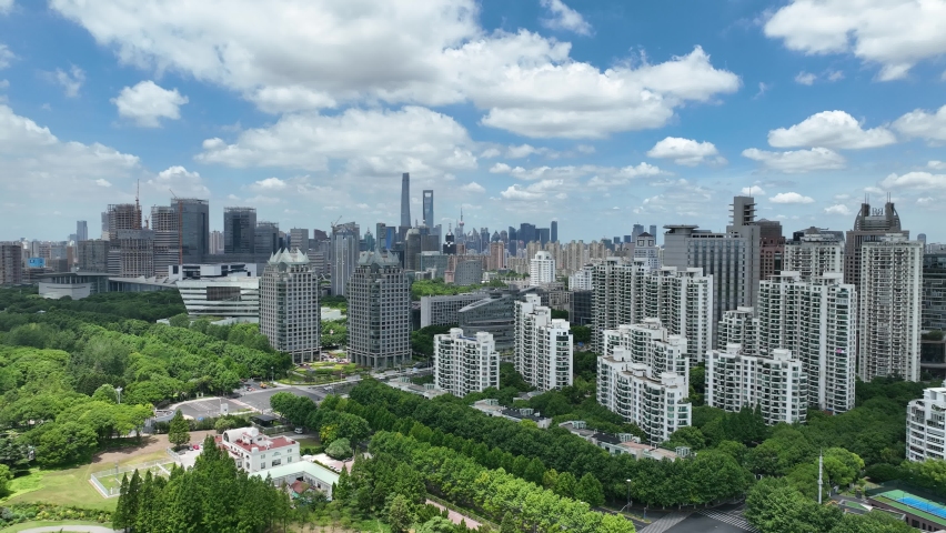 Park and the city skyline . Drone aerial view. Century park in Shanghai China. The city skyline in the background. Environment, nature, cityscape concept b-roll footage.