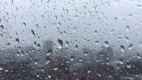 When it rains, the effect of water drops on the glass, simple video footage