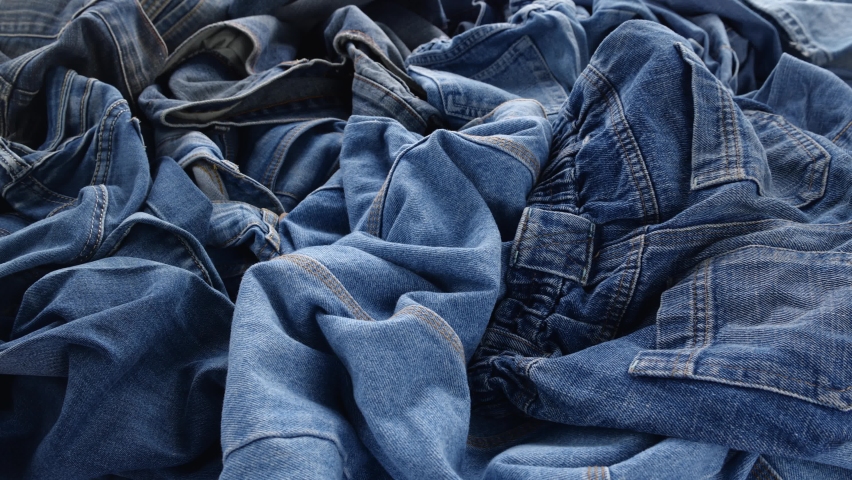 The Blue Jeans, Old denim clothing. Recycle Textile Waste. Fashion industry textile waste problem Royalty-Free Stock Footage #1096789959