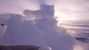 Beautiful Purple Fluffy Sunset Clouds View from Aircraft Window High Quality Travel Concept Footage. Thailand.