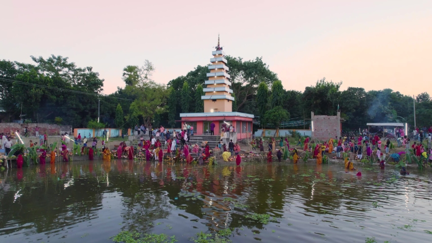 Aerial view of Chhath puja festival celebrated in the Indian states of Bihar, Uttar Pradesh, West Bengal, Jharkhand and also in the Nepal country, Chhath Mahaparv celebrated in the temple complex Royalty-Free Stock Footage #1096793319