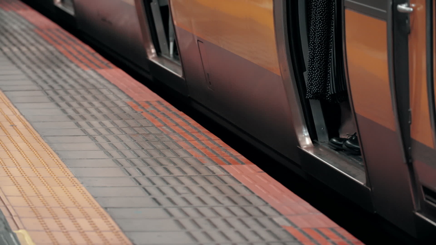 Platform gap close up as commuter train depart station. May cause serious hazard and injury of foot get stuck in the hole Royalty-Free Stock Footage #1096793965
