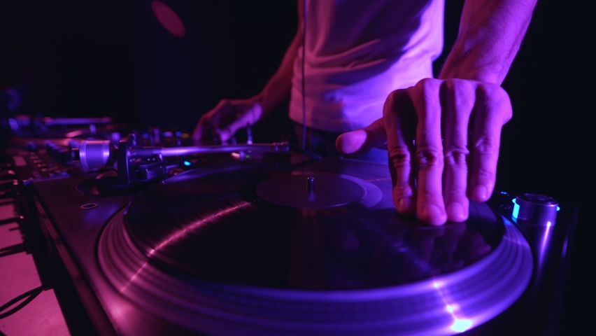 Hip hop dj scratches vinyl record on turn table player Royalty-Free Stock Footage #1096795911
