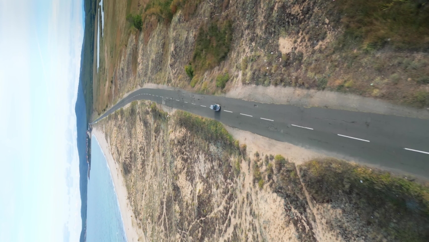 Vertical Aerial shot of Duni resort, Bulgaria. Aerial view of The Driver Beach near resort of Dyuni, Burgas Region, Bulgaria. Amazing road between sea and lake. Selective focus on Dyuni beach.