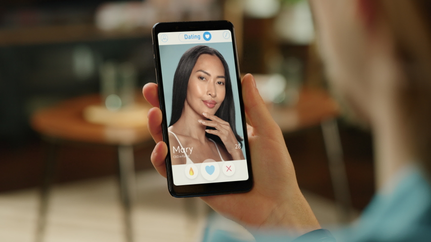 POV Dating App Concept: Person Uses Smartphone for Browsing Social Media Dating Application. Person Swiping, Searching, Screen Shows Matching with Partner, Finding True Love Royalty-Free Stock Footage #1096810161