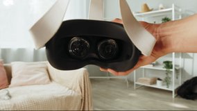 Wearing virtual reality glasses POV, playing video games, gamer using new generation gaming headset for entertainment at home, future technology concept. - Powered by Shutterstock - Get 15% off with code: PIKWIZARD15