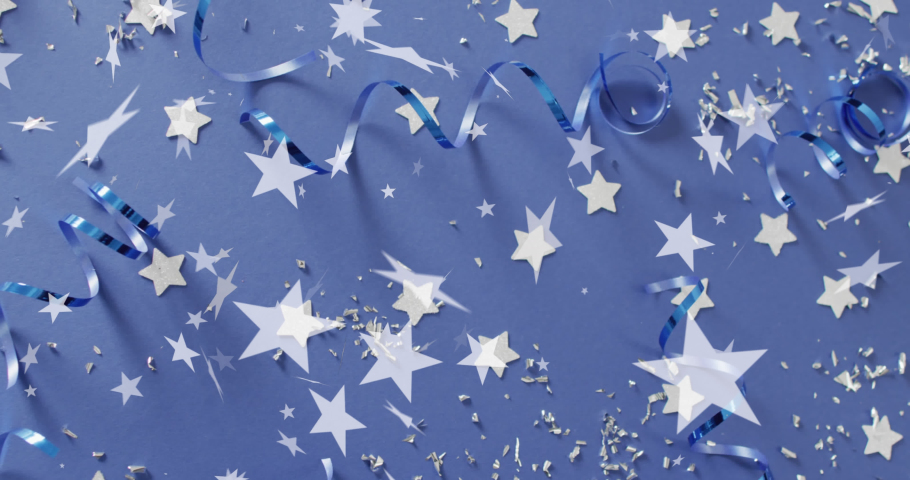Animation of stars falling over party streamers on blue background. New year's eve, christmas, festivity, celebration and tradition concept digitally generated video. Royalty-Free Stock Footage #1096826737