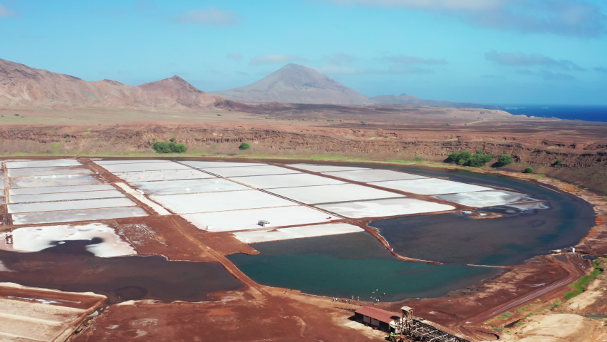 Cinematic aerial drone view over the Salt Mine at Pedra Lume, Sal Island, Cape Verde - Western Africa. Flying over the salinas near Santa Maria,