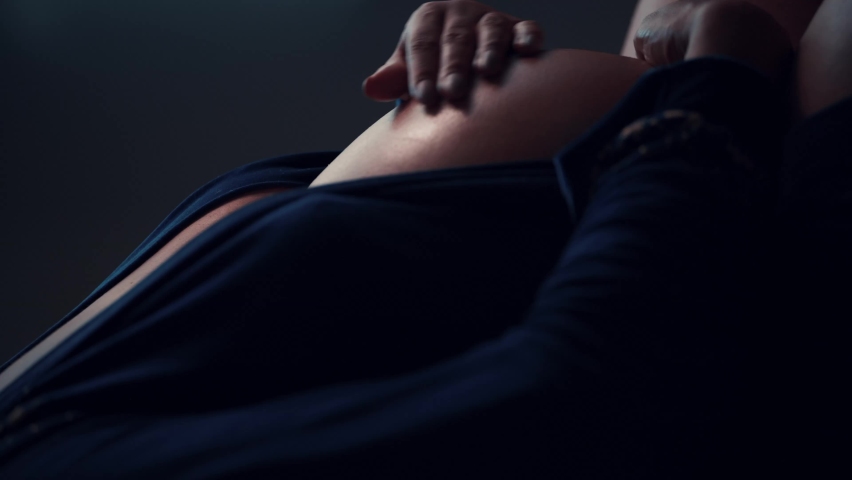 Profile of Pregnant woman rubbing her belly.  Royalty-Free Stock Footage #1096832415
