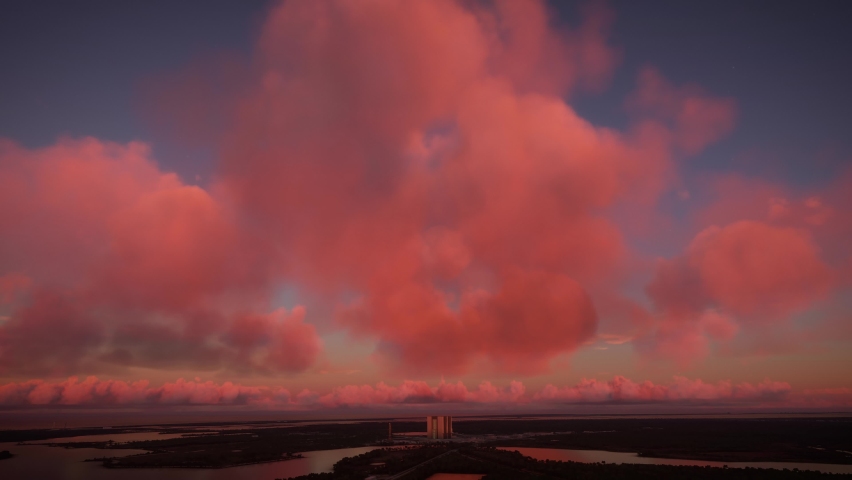 3D - Aerial view at sunset of the Kennedy Space Center in Florida. United States Royalty-Free Stock Footage #1096832859