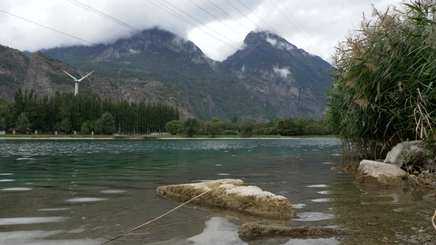 Beautiful mountain landscape by the lake. Land Switzerland. Realxing area . Slow motion 4K