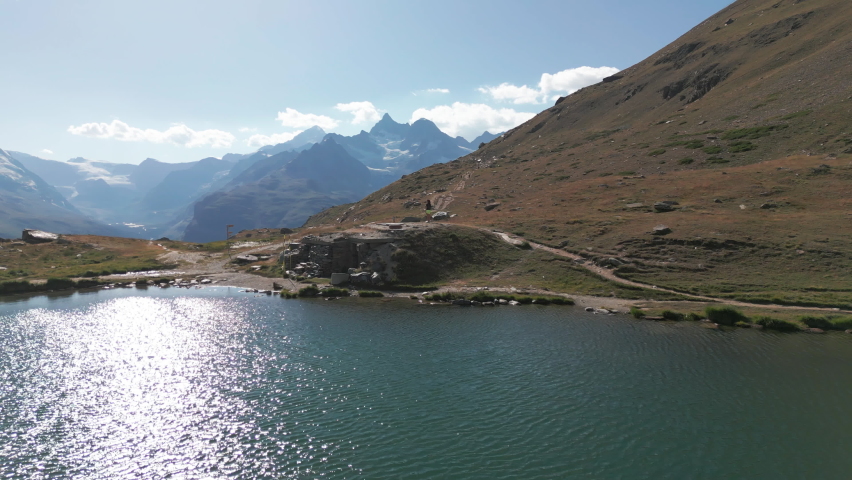 Aerial girl  landscape alone Aerial drone shot Zermatt Lake Stellisee Matterhorn Switzerland