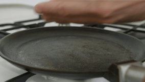 Pita cooking on the hot pan, flipping with scapula, timelapse video