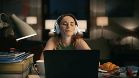 Satisfied lady texting laptop at home workplace closeup. Headphones woman chatting computer. Motivated freelancer having good mood listening music. Brunette girl feeling busy using digital device - Powered by Shutterstock - Get 15% off with code: PIKWIZARD15