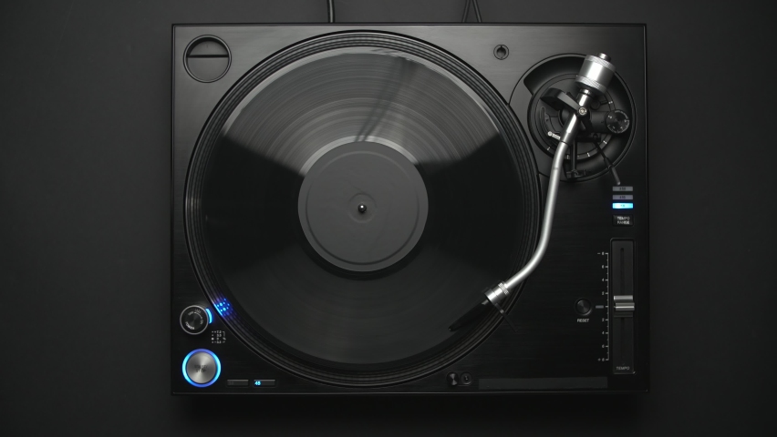DJ turntable playing vinyl record with music in flat lay 4K video clip Royalty-Free Stock Footage #1096876097