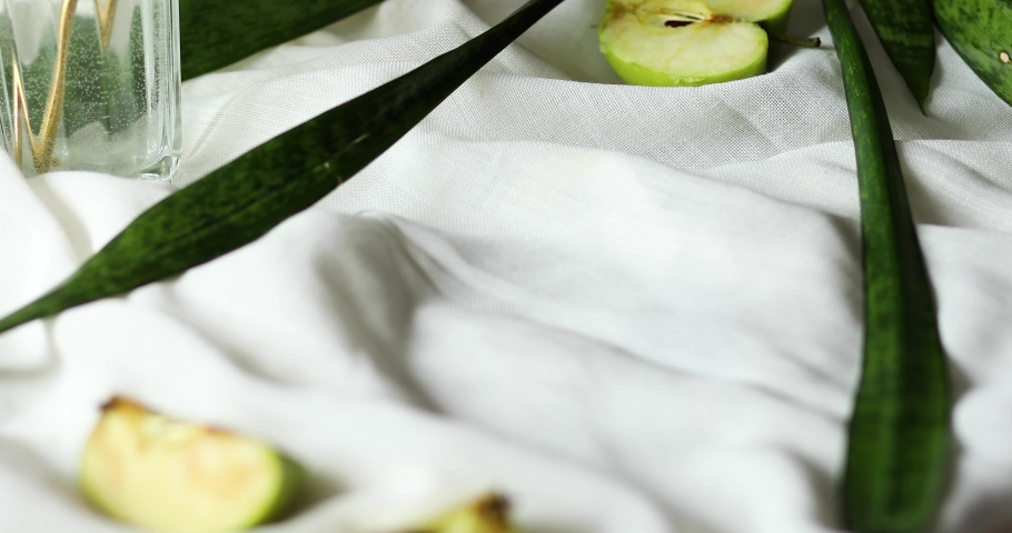 Woman hand put bowl of morning granola breakfast with greek yougurt and glass of detox water with lemon on the table, Homemade oatmeal granola, healthy food.