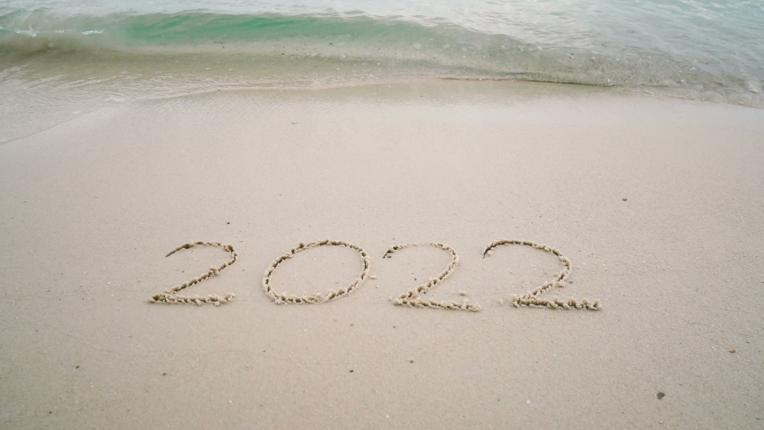 4K happy new year 2023. number 2022 write on sandy beach, ocean wave splash change to 2023. countdown for happy new year turning from year 2022 to 2023 video footage background Royalty-Free Stock Footage #1096880383