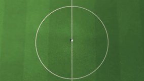 Camera zooms into the middle of a full football or soccer stadium, soccer ball in the middle, top view. Kickoff moment. - Powered by Shutterstock - Get 15% off with code: PIKWIZARD15