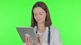 Video Call on Tablet by Female Doctor on Green Background 