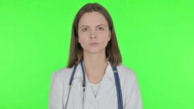 Female Doctor Talking on Online Video Call on Green Background 