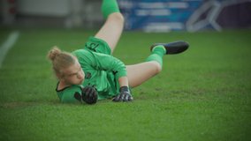 Professional Soccer Football Match Championship: Goalkeeper Catches the Ball Professionaly, Saving the Gates. Sport Channel Broadcast Television, Tracking Playback. Slow Motion - Powered by Shutterstock - Get 15% off with code: PIKWIZARD15