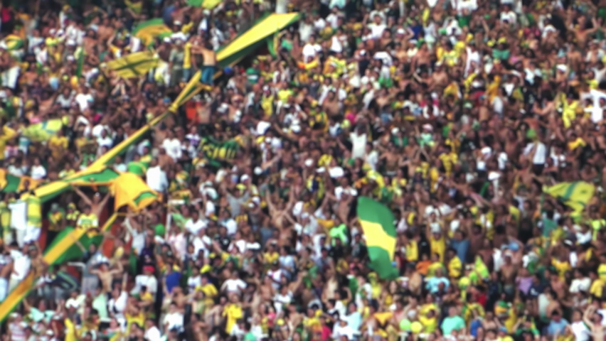 Blurred People in Crowded Soccer Stadium in South America. 4K Resolution. Royalty-Free Stock Footage #1096890879