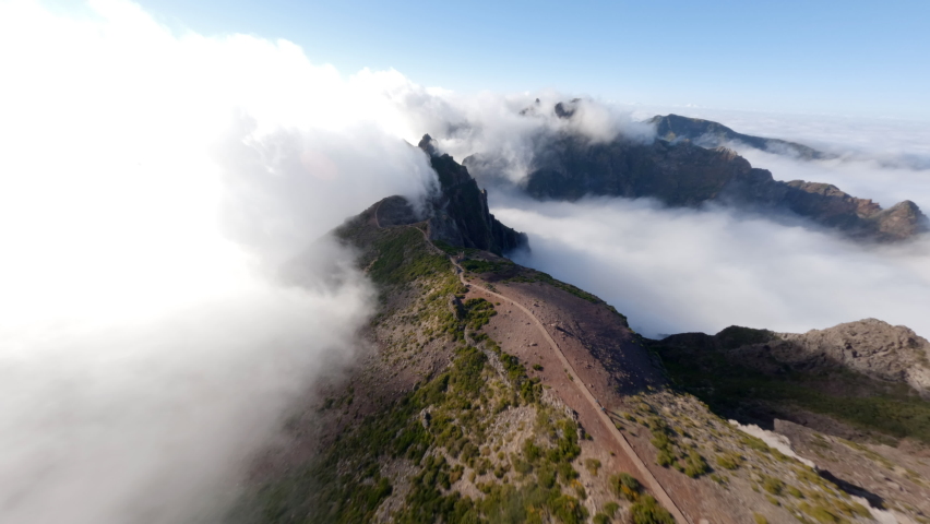 FPV Drone View of Pico de Areiro over the clouds during sunrise Royalty-Free Stock Footage #1096892715