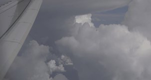 Plane in the clouds tilts, 4K
