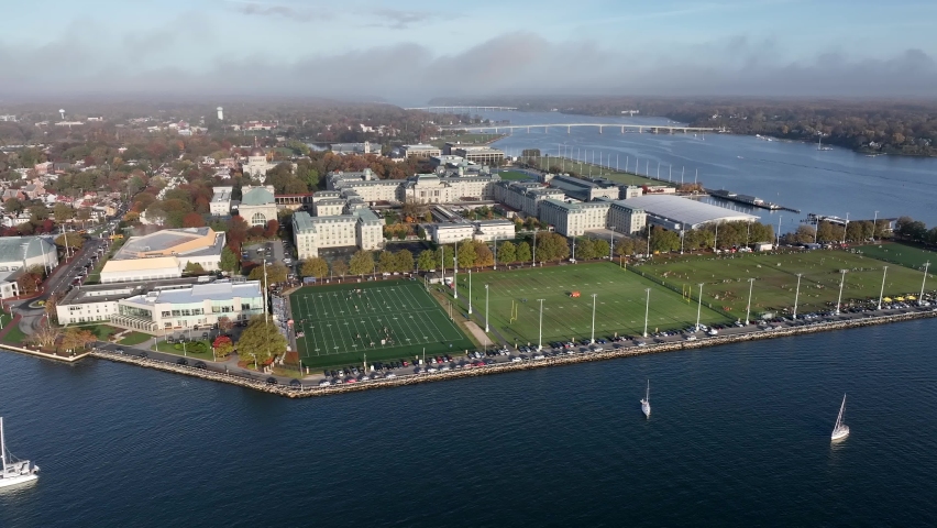 US Naval Academy and Marine Corps training facility in Annapolis Maryland by Severn River. Boats on water. Aerial view. Royalty-Free Stock Footage #1096895613
