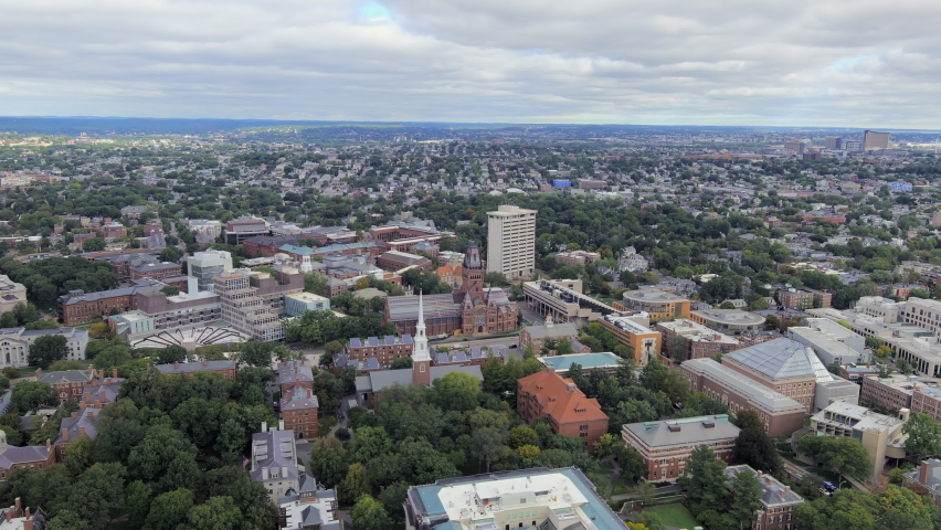 Aerial Panoramic View Of Harvard Yard Outside Memorial Church, Harvard College, And Harvard University Buildings In Cambridge, Massachusetts, USA. pan right