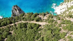 Aerial drone video of steep white cliffs in secluded paradise beach in Northern part of Kefalonia island, Ionian ,Greece