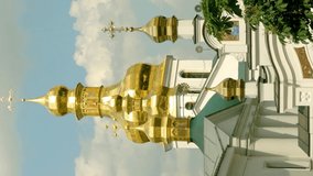 Orthodox Christian monastery. Golden domes of cathedrals and churches, Kiev-Pechersk Lavra Monastery, blue sky with clouds.