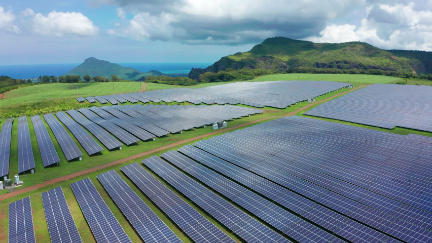 Solar panels to generate electricity on a green island. Renewable Energy Theme. Environmentally friendly electricity Royalty-Free Stock Footage #1096902399