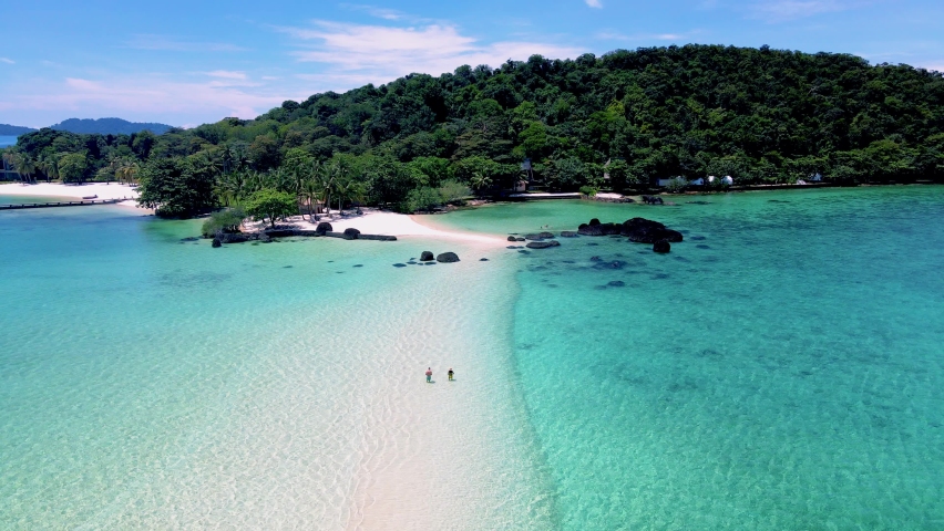 Couple man and women on a tropical island in Thailand, Koh Kham Island Trat Koh Mak. tropical beach with white sand and blue ocean with palm trees | Shutterstock HD Video #1096907441