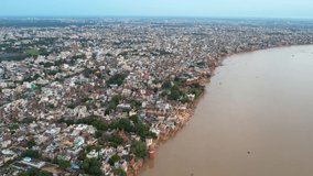 Aerial video 4k of Varanasi city with  Ganges river, ghats, the houses in Varanasi, Banaras, Uttar Pradesh, India