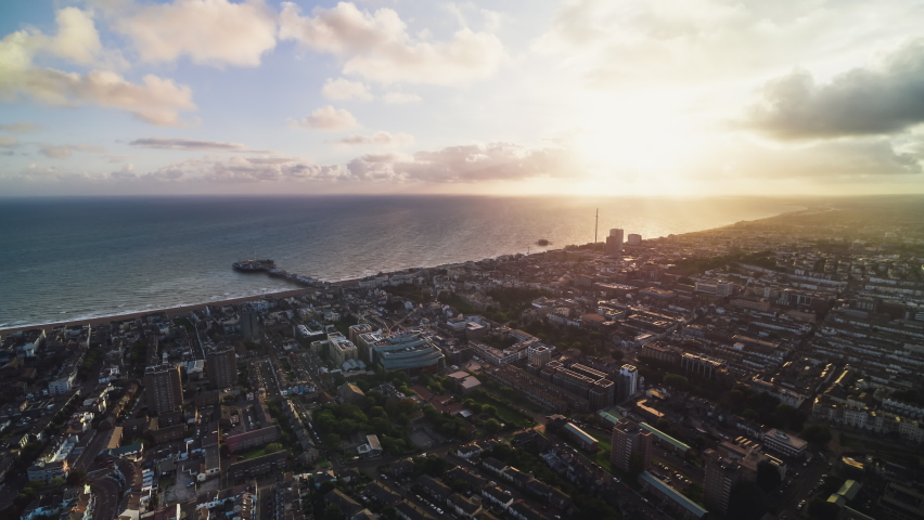 Establishing Aerial View Shot of Brighton UK, East Sussex, England United Kingdom day, incredible heavenly light, pull back reveal Royalty-Free Stock Footage #1096913825