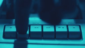 Using old cassette tape deck - close up of hand pressing play button - Powered by Shutterstock - Get 15% off with code: PIKWIZARD15