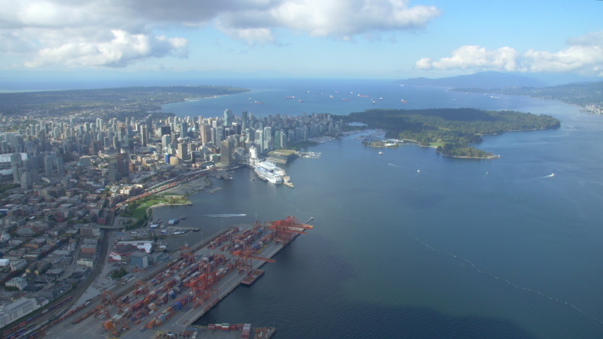 Downtown Vancouver and BC Place Helicopter shot looking west towards Coal Harbour and Stanley Park in British Columbia.
