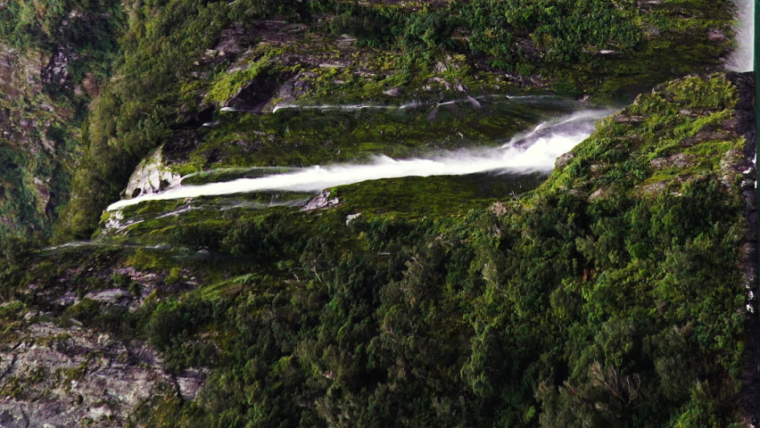 Majestic Stirling Falls in South Island of New Zealand, aerial drone vertical view